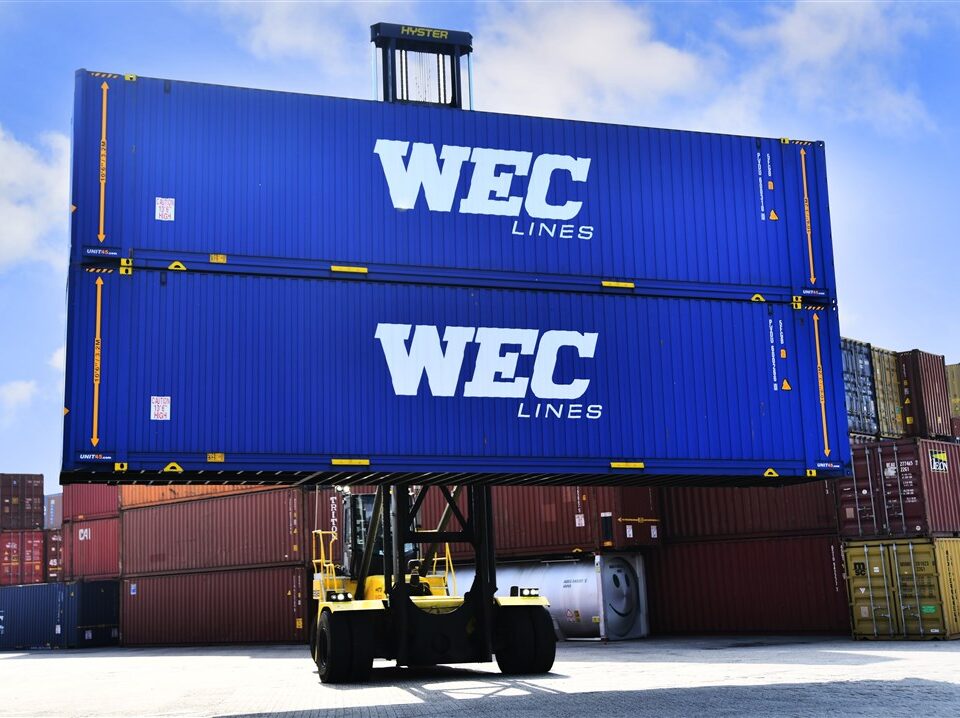 Two WEC Lines containers on a forklift