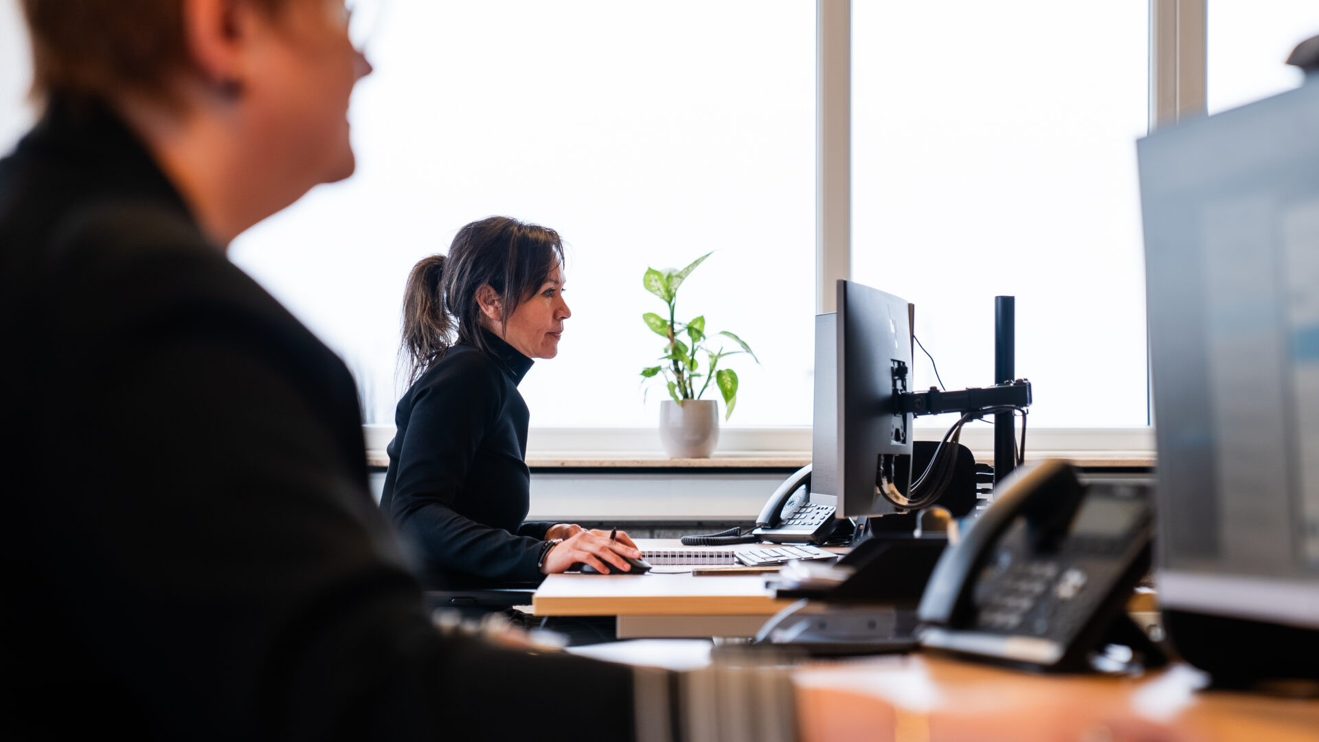 Rubilita working at her desk